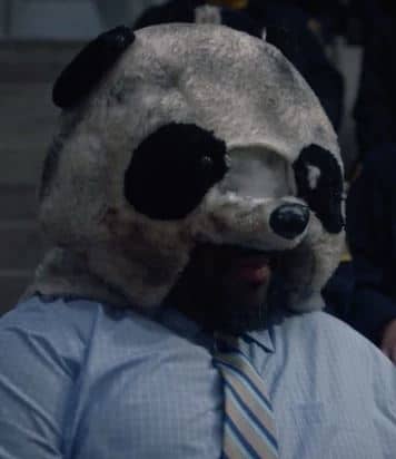 Jacob Ming-Trent portraying role of cop wearing Panda mask in TV series watchmen.